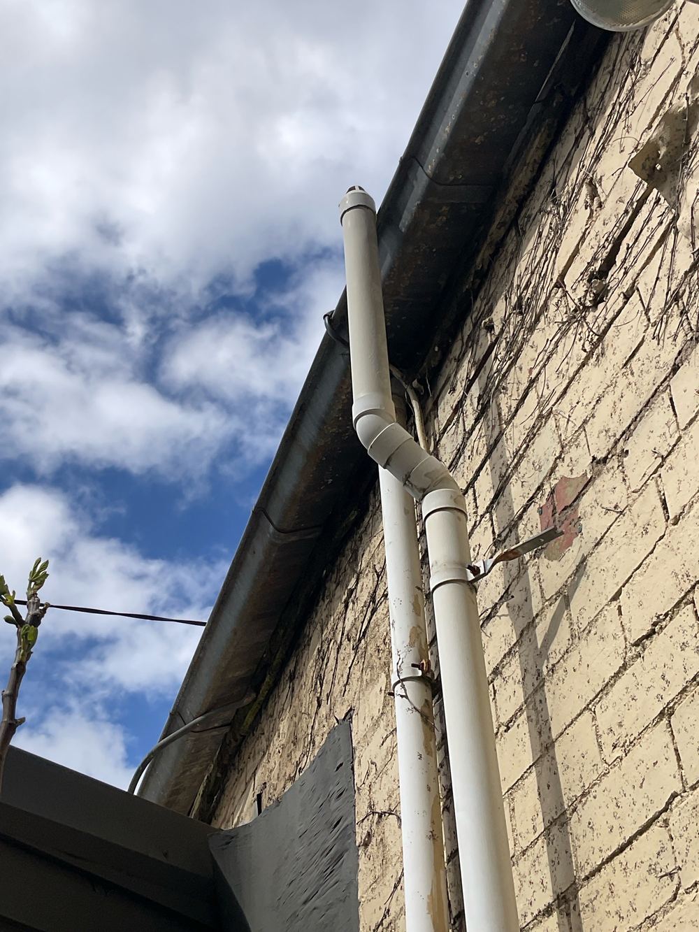 Damaged gutter and fascia letting water soak the ground near the footings, found during a defect investigation inspection in Richmond
