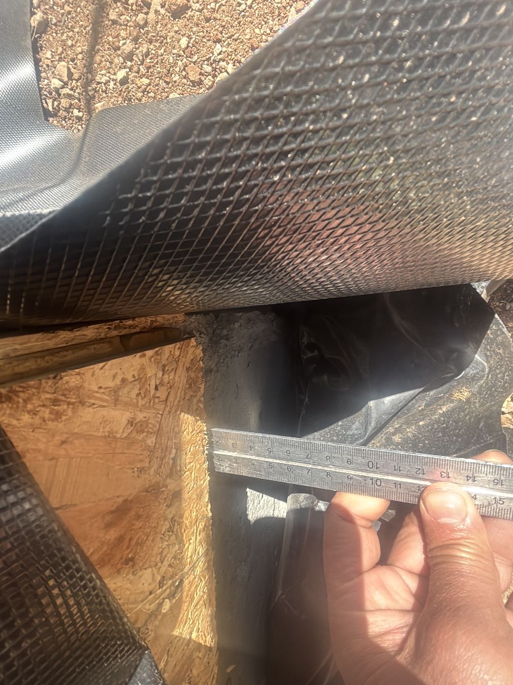 Bottom plate overhanging the slab edge by more than 10mm, found during a lock-up inspection in Hoppers Crossing