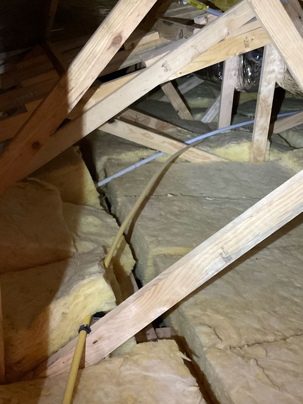 Gas pipe on the outside wall left unclipped instead of properly secured, found during a pre-handover inspection in Wyndham Vale