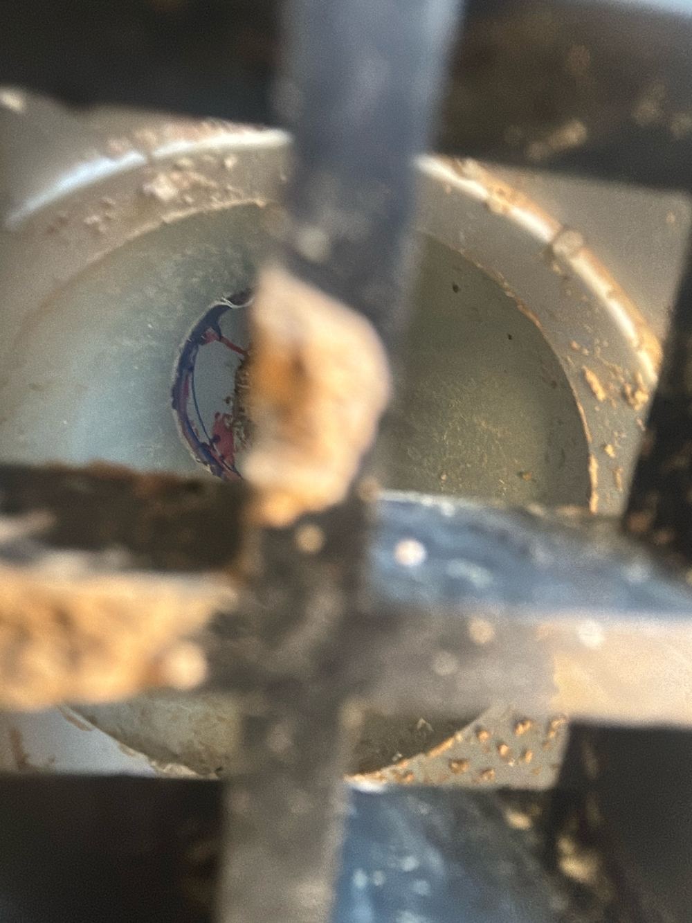 Soil and debris sitting in the silt pit, risking a blocked stormwater line, found during a pre-handover inspection in Wyndham Vale