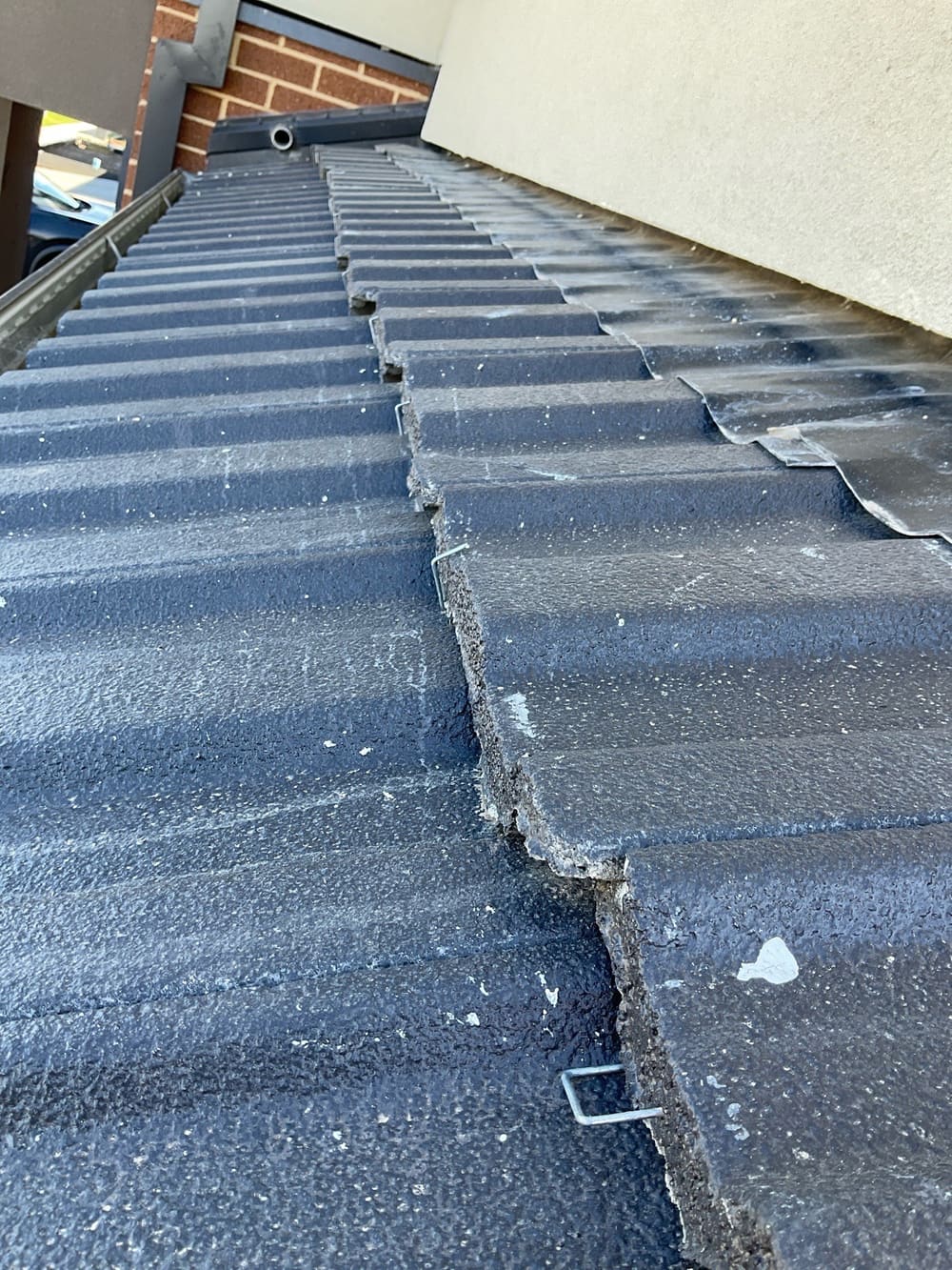 Reposition roof tile, recorded during a pre-purchase inspection in Manor Lakes