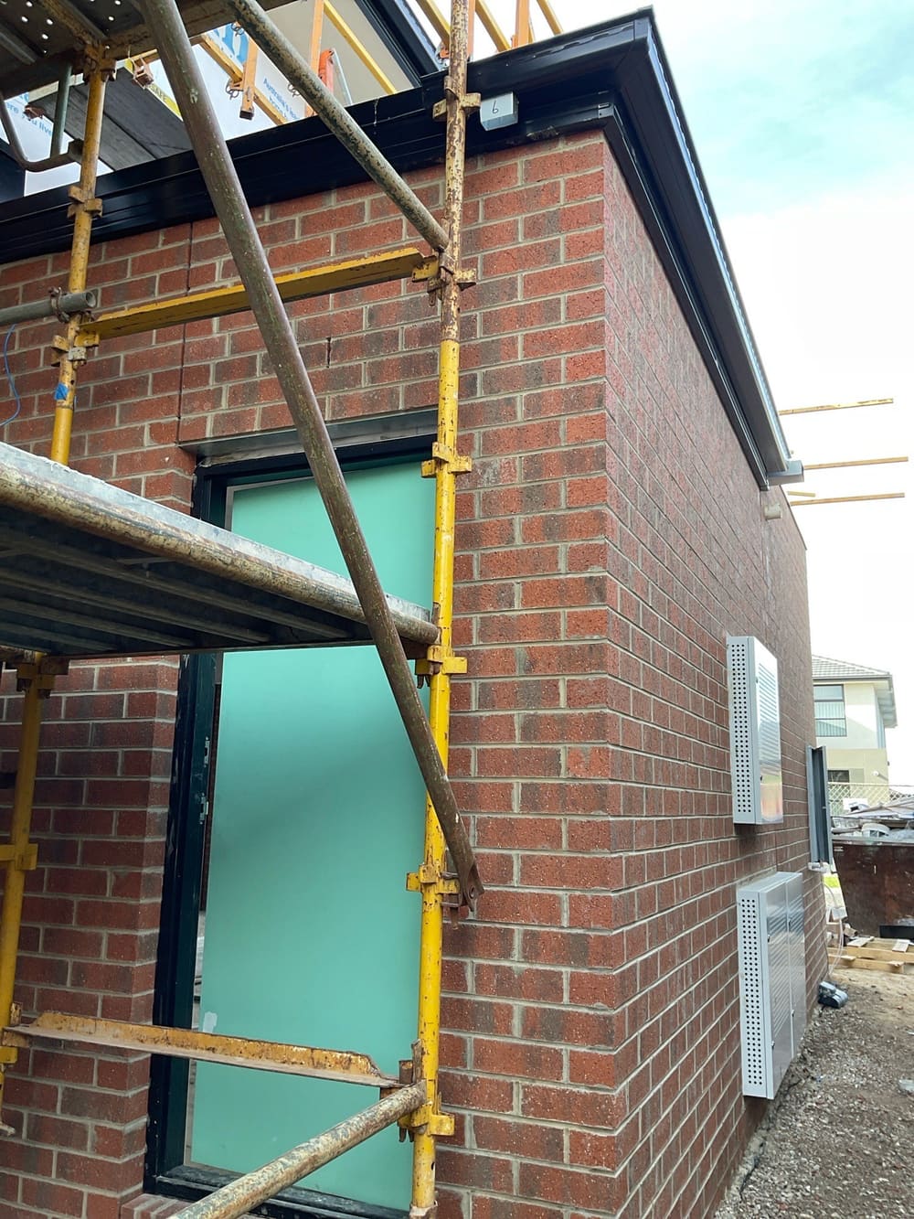 Temporary downpipes not installed, recorded during a building inspection in Manor Lakes